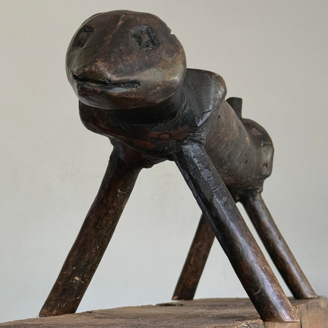 Antique Folk Art Hand Carved Zoomorphic Footstool Carved from a single piece of wood, this long, narrow folk art footstool...