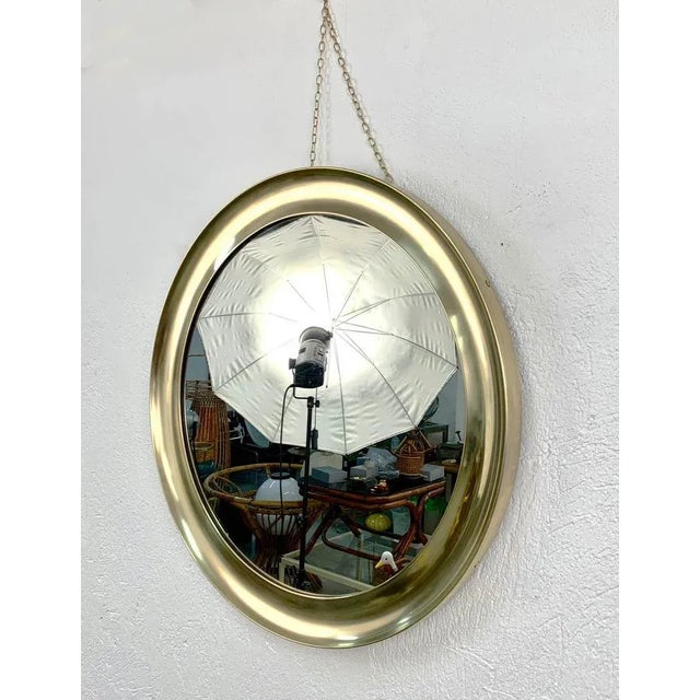 Beautiful large and vintage mirror with a 83 cm diameter produced by Sergio Mazza for Artemide during the 1960s in Italy....