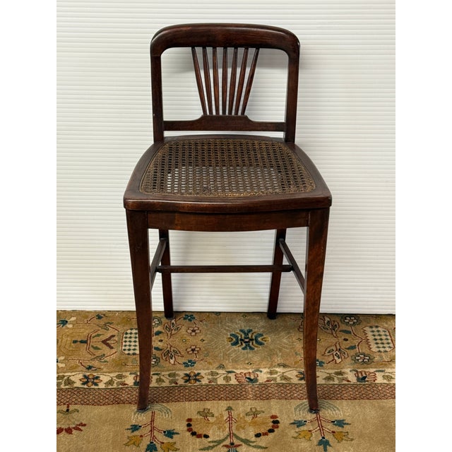 Design Plus Gallery presents an Antique Edwardian Mahogany Fan Back Cane Seat Side Chair. Dating to the early 20th...