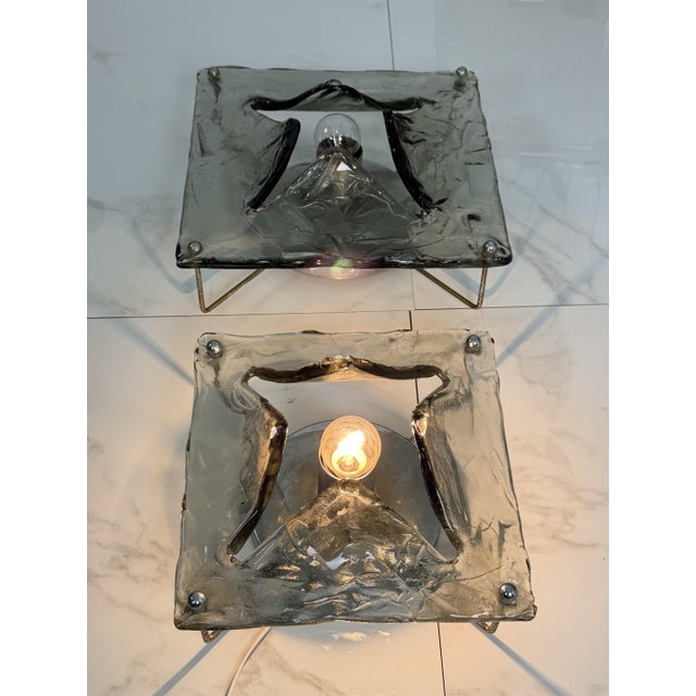 Set of two smoky Murano glass wall lamps, different sizes, 1970s In the style of Toni Zuccheri for Venini, one measures 30...