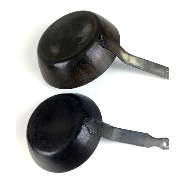 We love these pans. Use them for cooking or hang on your wall for a vintage rustic theme. In clean and useable condition.