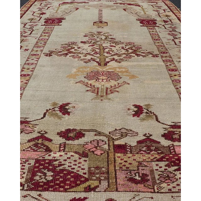 Antique Turkish Oushak rug in ivory background and various tones and unique Color combination in Columns, Chandelier &...