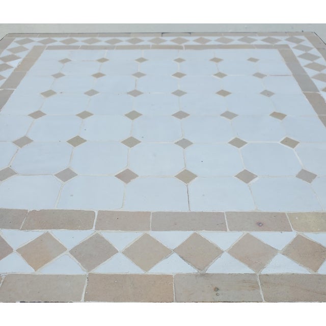 Beautiful white and beige mosaic tile table. An indoor / outdoor table of approximately 20" x 20" and 20" in height....