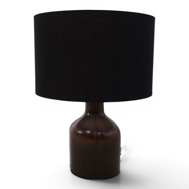 This elegant table lamp from the Rosenthal studio line dates back to the 1970s and impressively combines timeless design...