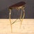 Mid-20th-century Italian console table. Chiseled and gilded brass furniture with a mahogany top. This compact console...
