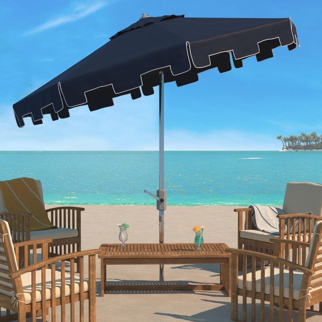 A classic market umbrella gets a chic makeover with fashion forward navy fabric and a valance for extra sun protection and...