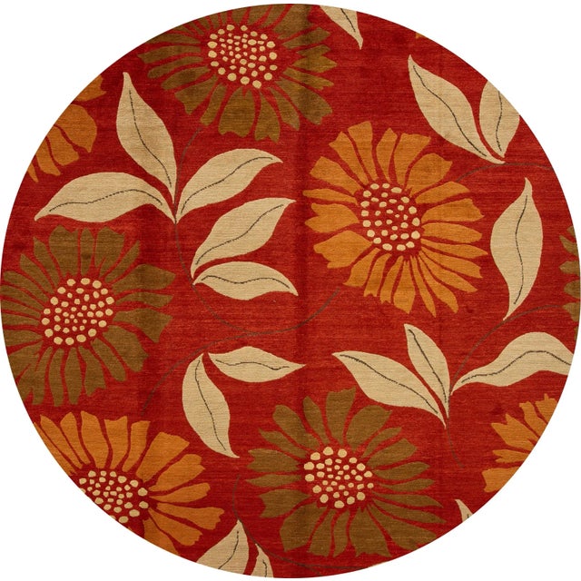 A beautiful 21st century contemporary Tibetan wool rug, hand-knotted wool with a red field, and multi-color accents in...