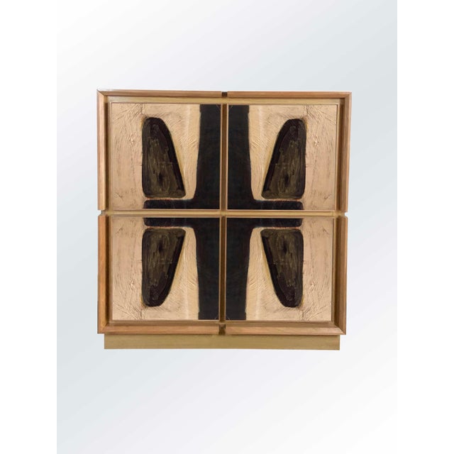 Oak sideboard with cherry frames and walnut details. Divided into four spaces with internal shelves, it has four doors...