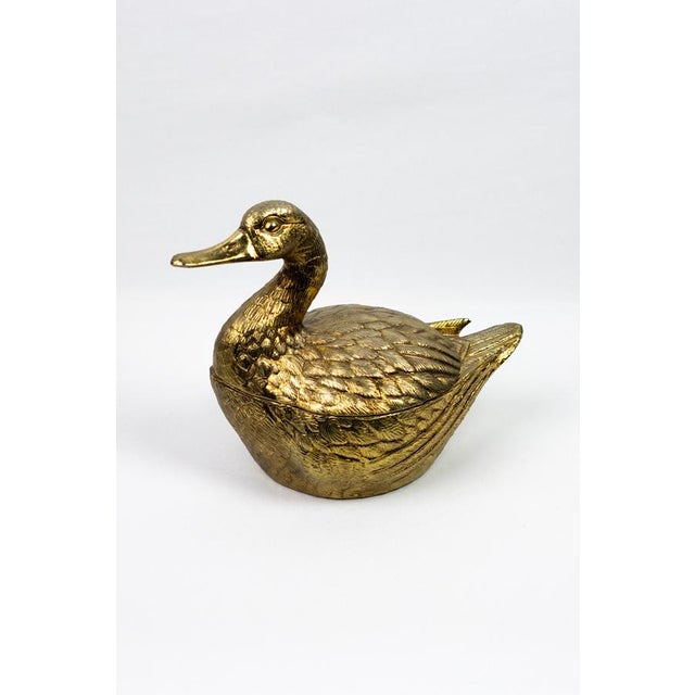 Cast metal ice bucket with a gold patina achieved through metallic deposition. The white lacquered interior ensures...