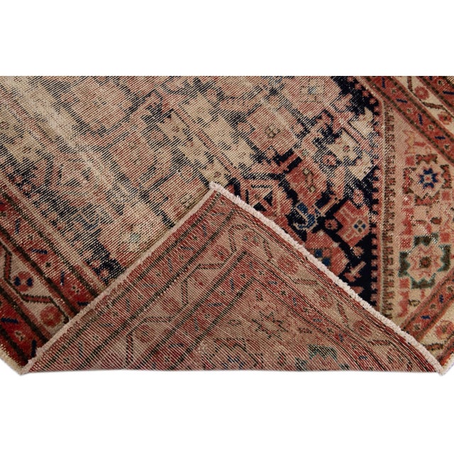 Beautiful Vintage Malayer hand-knotted wool rug with a blue distressed field. This Persian Runner has red accents all over...