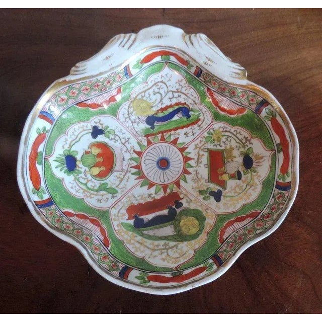 Antique 18th c. Worcester bengal tiger shell shaped plate in bright palette enhanced by gilding. Measures 8" across. Good...