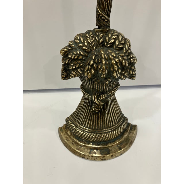 This brass door stop dates from 1800-1820 The sheaf of wheat has a long handle for easy moving There is a lead weight in...