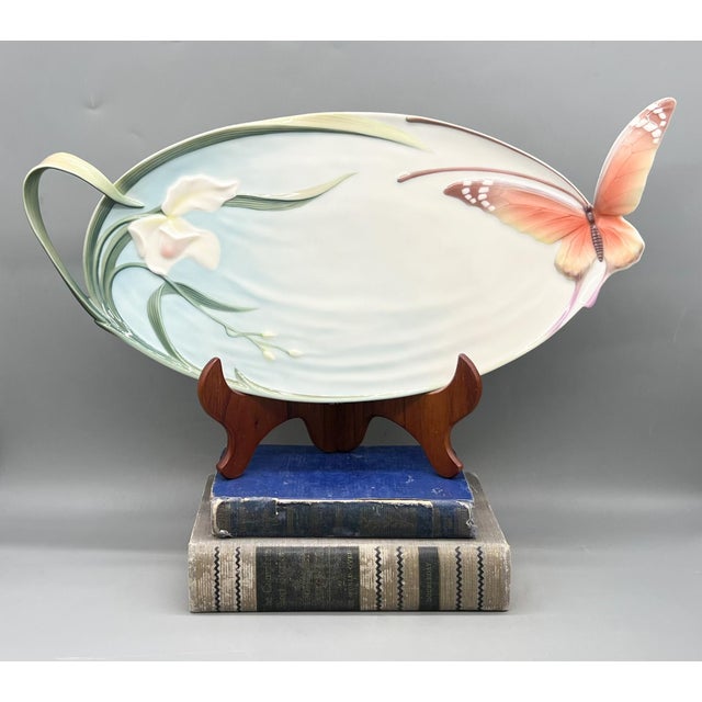 Captivating Franz porcelain sculptural platter, model XP1694, featuring a blooming iris and graceful butterfly in...