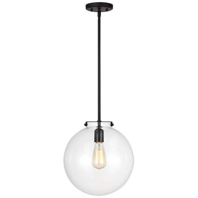 The Kate cone pendant is offered in the Satin Brass, Midnight Black, or Brushed Nickel finish. The flared, clear glass...