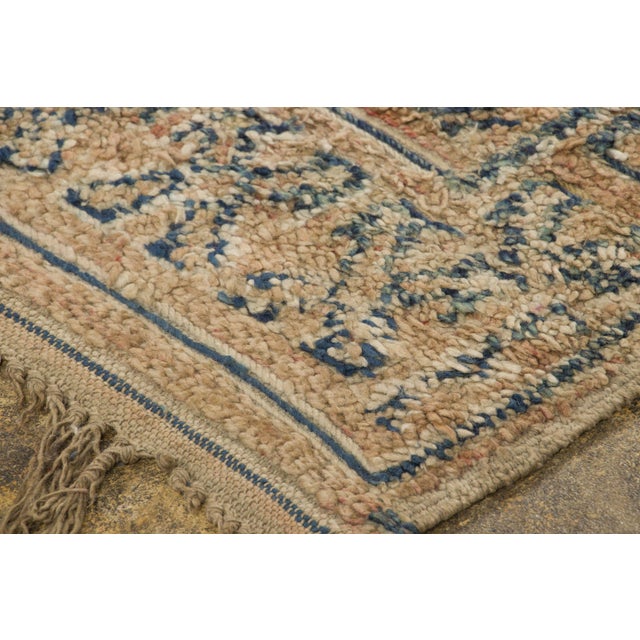 Hand-knotted in wool and originating circa 1950-1959, this 6x11 vintage Moroccan berber rug joins Rug & Kilim’s Moroccan...