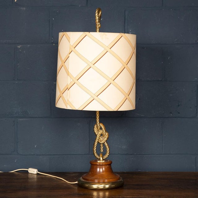 A very stylish table lamp with the original period shade. The rope motif was typical of Gucci homeware and it is...