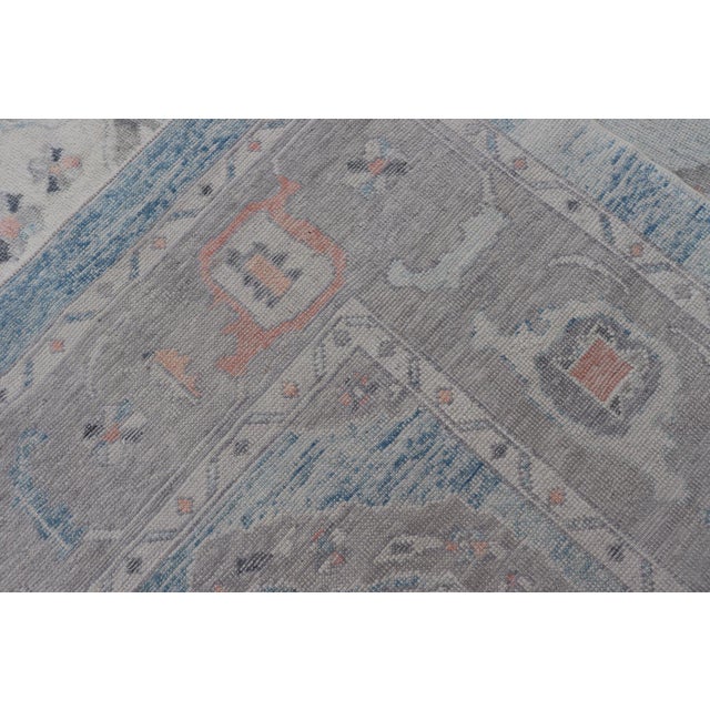 All-Over Tribal Motifs Design Light Blue With Hints of Orange Turkish Oushak Rug For Sale - Image 11 of 12