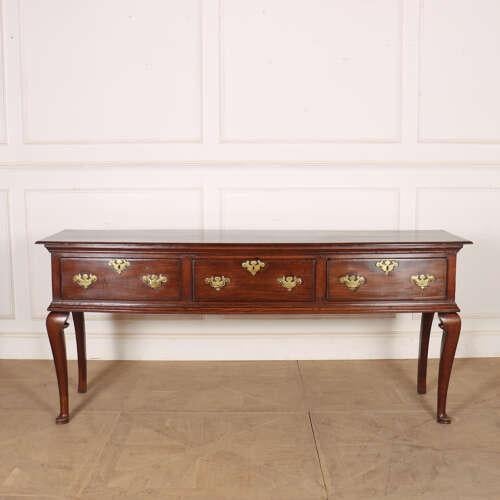 Good 18th century English oak dresser base with nice colour throughout. 1760. This piece is designed in the style of the...