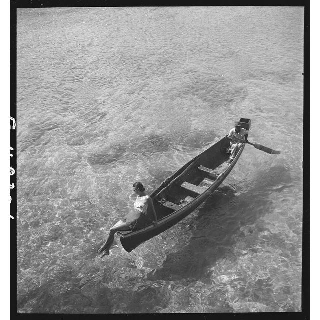 Model in Montego Bay 1946 Fashion model bein rowed across Montego Bay, Jamaica, 1946. Toni Frissell Antoinette Frissell...
