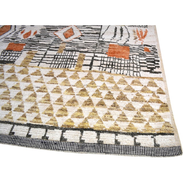 Hand-knotted with care using traditional rug making techniques, this wool rug blends timeless craftsmanship with a modern...