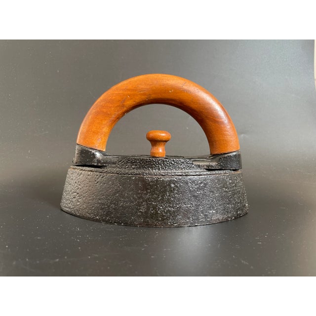 Antique Enterprise Manufacturing Company Cast Iron Sad Iron With Wood Handle. Marked "ENTERPRISE IRON PAT MAY 24, 70" and...
