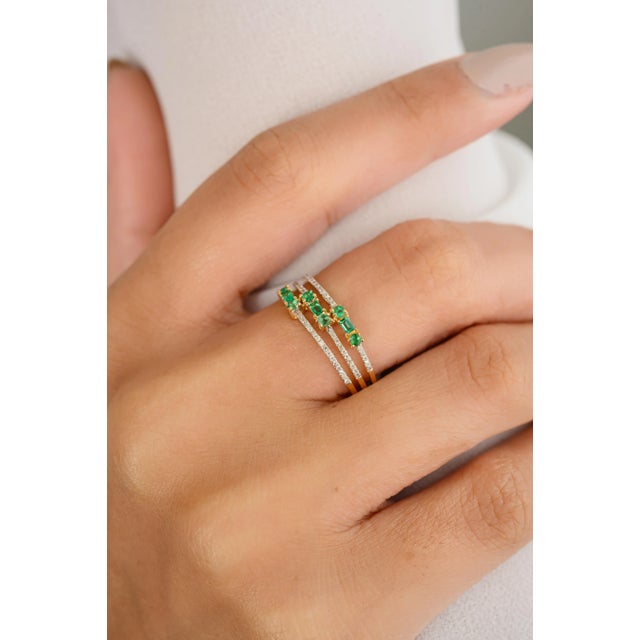 Emerald Diamond Triple Row Wedding Band Ring in 18K Gold featuring natural emerald of 0.17 carats and diamonds of 0.091...