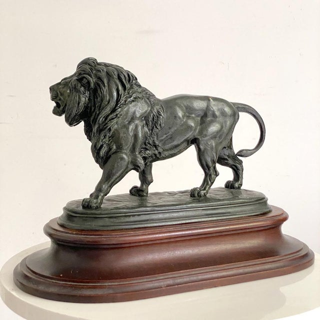 Bronze sculpture of a walking lion, after Édouard Paul Delabrierre (1829-1912) Dimensions excluding base: Height: 19 cm...