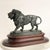 Bronze sculpture of a walking lion, after Édouard Paul Delabrierre (1829-1912) Dimensions excluding base: Height: 19 cm...
