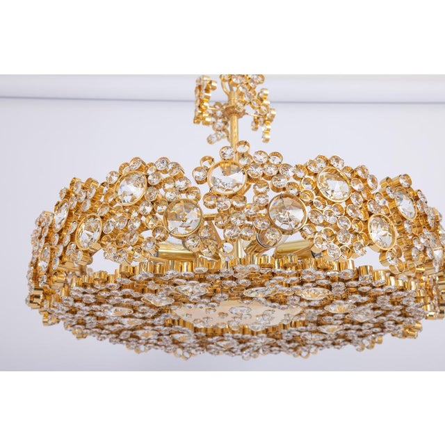 A wonderful and high-quality gilded chandelier/pendant light fixture by palwa (palme & walter), germany, 1970s it is made...