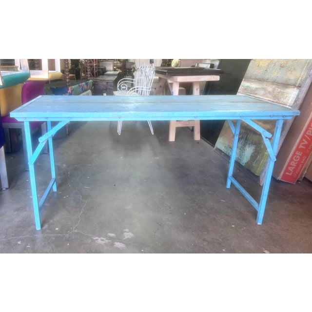 Vintage rustic Blue wood and metal folding console table. Knee height- 27” Acquired from Blue ocean Traders in 2021.