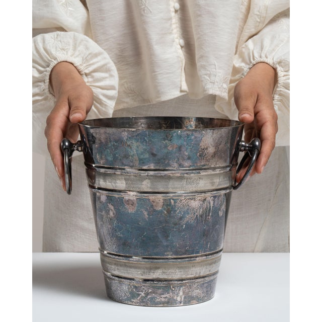 This mid 20th century ice bucket from France is finished in teal, worked in silver. Its form follows honest, well-...