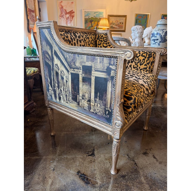 Love this chair with a neoclassical painted motif on canvas around the exterior and leopard velvet on the inside