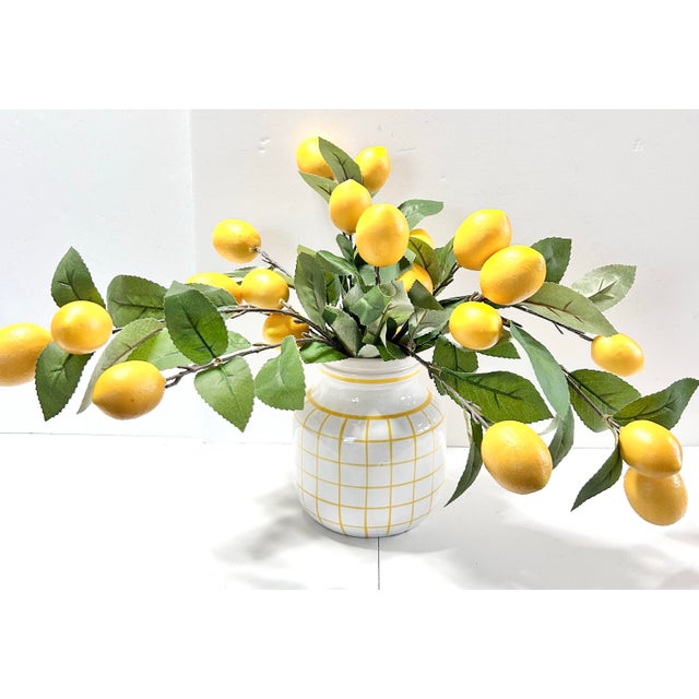 A clean-lined vintage Italian ceramic vase featuring a hand-painted yellow grid over glossy white glaze, offering a subtle...