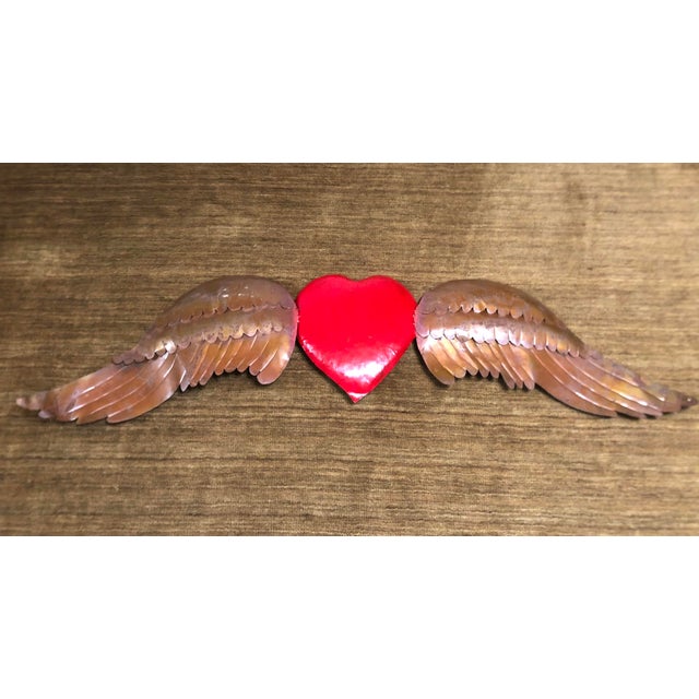 Stunning red heart with copper wings, has a great rustic look with original patina. The winged, flying heart is a...