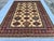 This magnificent hand-knotted wool area rug showcases an authentic, highly detailed Afghan Kazak tribal style. The large...