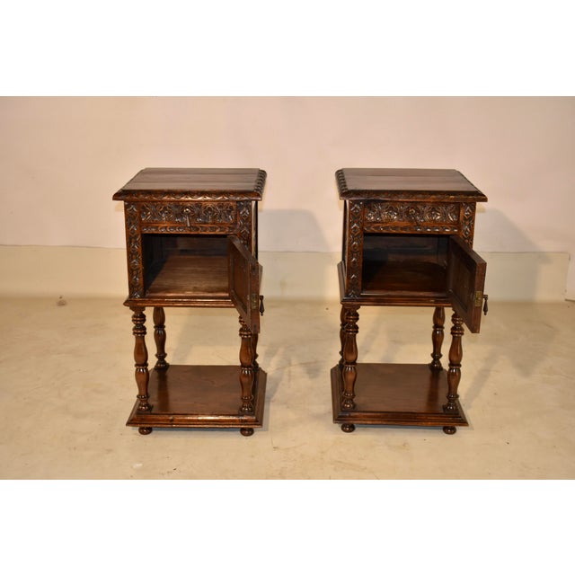 Pair of 19th century oak side tables from France. The tops are nicely grained and have beveled and carved edges, following...