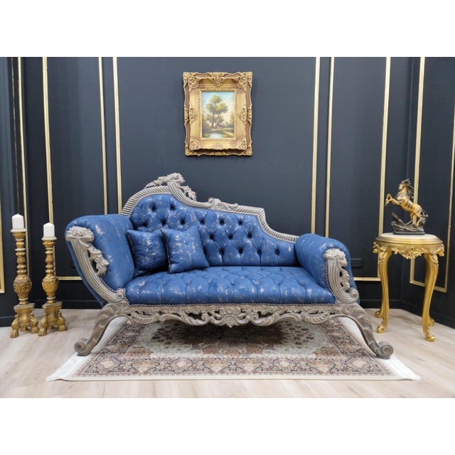 Elevate your space with this exquisite French style chaise lounge featuring an aged gold leaf frame finish. Hand carved...