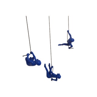 Blue Climbing Man Wall Art For Sale