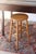 A tall stool with a round seat and turned wood legs handmade. Great farmhouse rustic style. Great patina to the wood and...