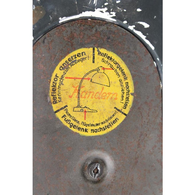 Black painted original! Swiveling made of press fabric over ball joints, glass base. Literature: "Bauhauslucht?...