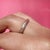 About This Ring: A timeless platinum band carrying the gentle marks of a life well-lived. Delicate engraving reveals a...