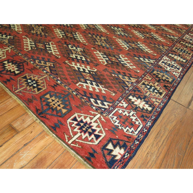 Tribal decorative Turkeman rug in rustic tones Measures: 5'4" x 9'3".