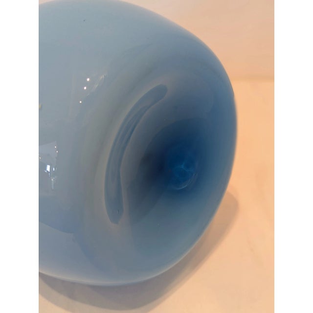 This vessel exemplifies Empoli’s mid-century glass production, particularly the “genie bottle” form exported heavily to...