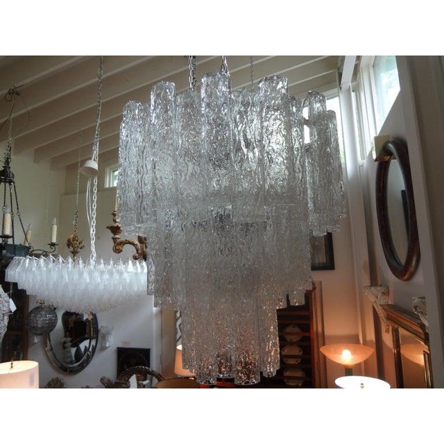 Unusual Italian midcentury Murano glass chandelier inspired by Venini. This vintage Murano chandelier is comprised of...