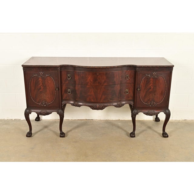 A gorgeous antique Georgian or Chippendale style serpentine front sideboard buffet or credenza By Romweber USA, Circa...