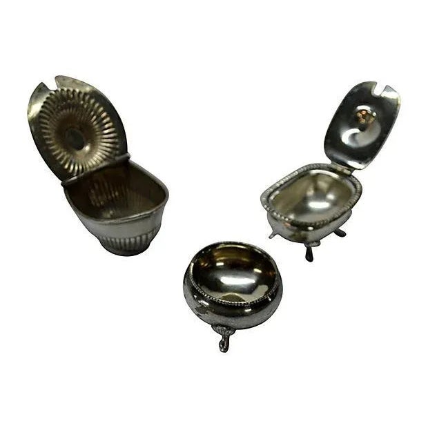 Three old collectible silver cellars. One of them consists of an Open Salt/English Style/three footed/rope border. The...