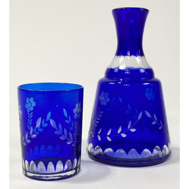 Vintage Bohemian cut to clear cobalt blue bedside decanter and tumbler set. Early 20th C (1911-1940) set from the renowned...