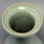 Fine antique Chinese celadon pear‑shaped vase. Elegant slender neck rising from rounded pear‑form body, covered in natural...