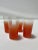 Set of 4 Mid-Century Bendo Faded Orange Tumblers that are unmarked. There is a faded gold rim on each glass that is...