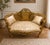 Add a touch of timeless French elegance to your interior with this exquisite Louis XV–style settee. Featuring an ornate...